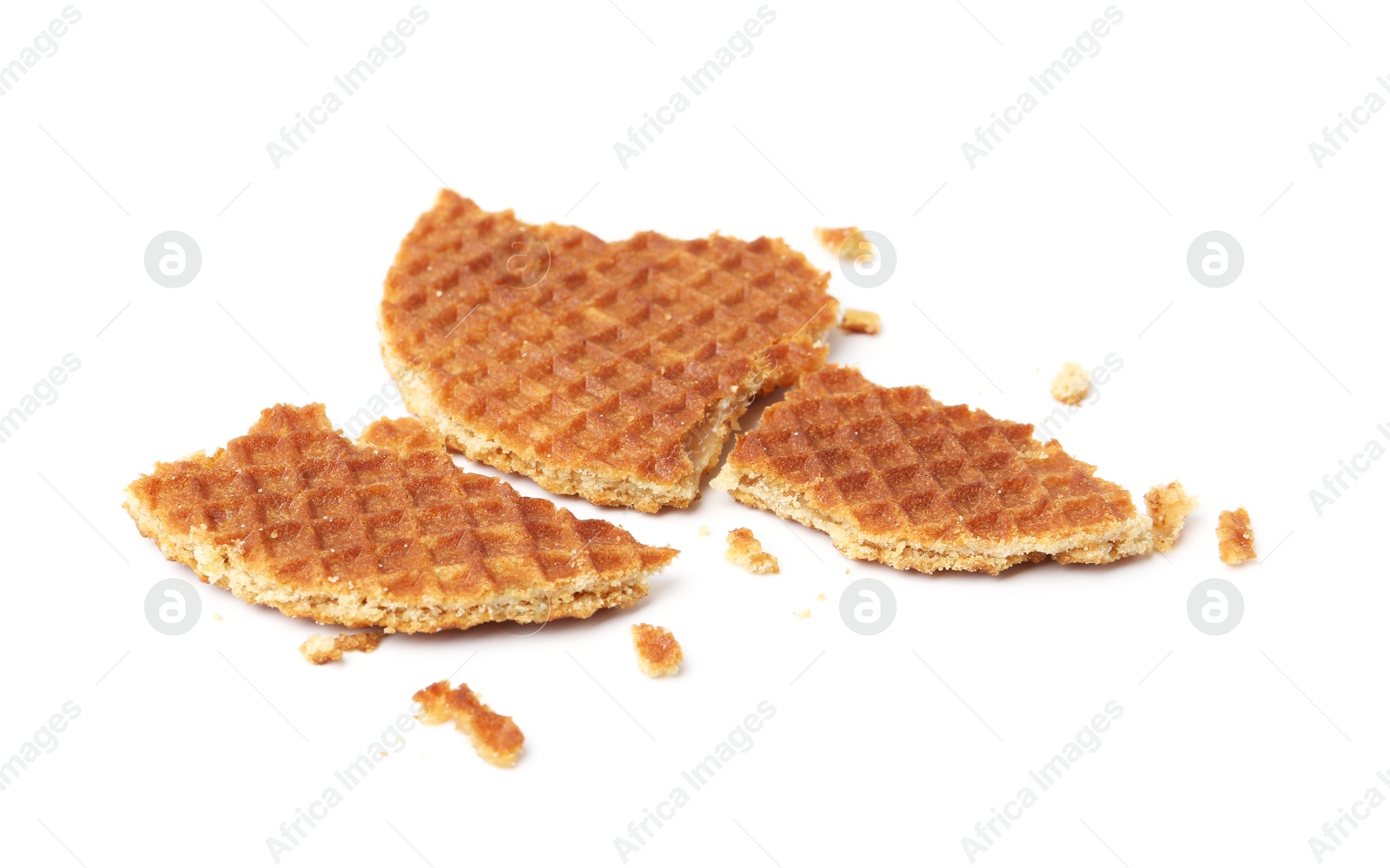 Pieces of tasty waffle isolated on white Photo of Pieces of tasty waffle isolated on white