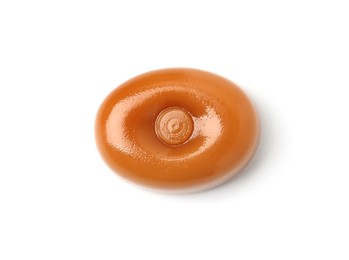 Photo of One tasty toffee candy isolated on white, top view