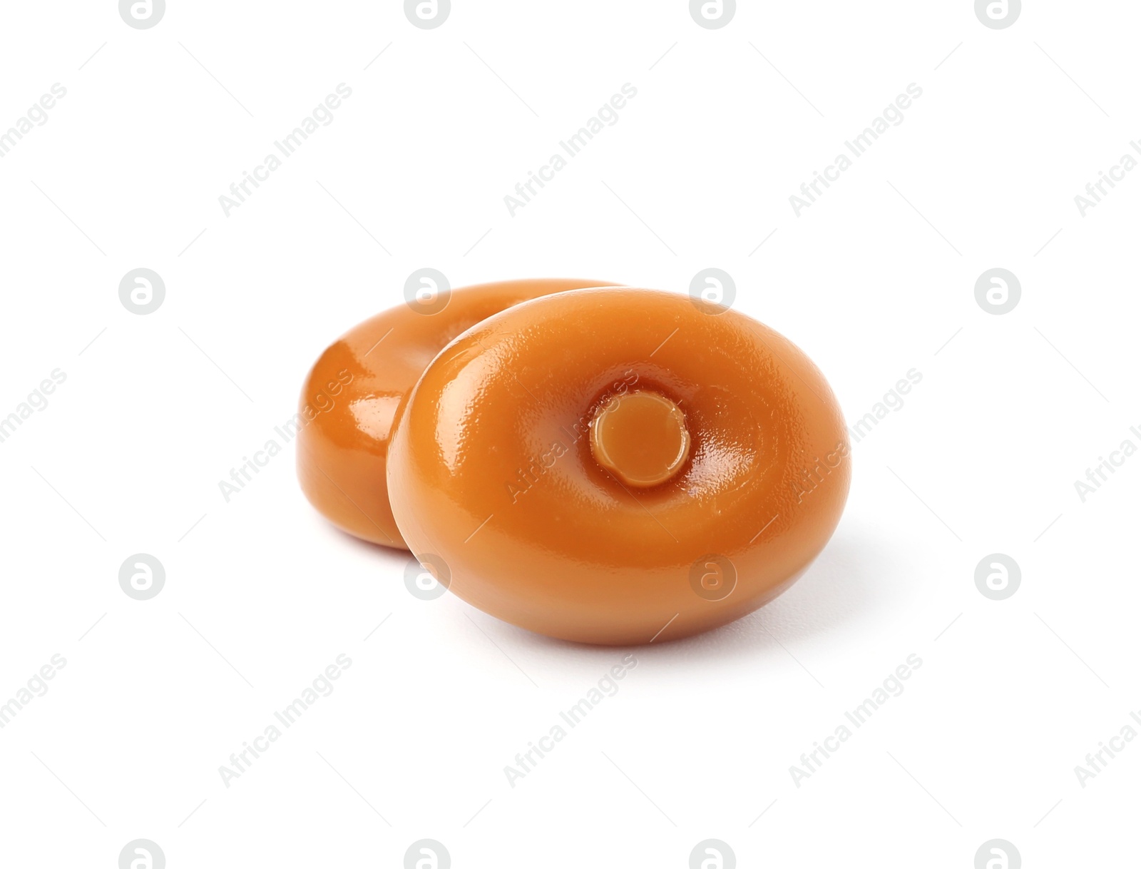 Tasty hard toffee candies isolated on white Photo of Tasty hard toffee candies isolated on white