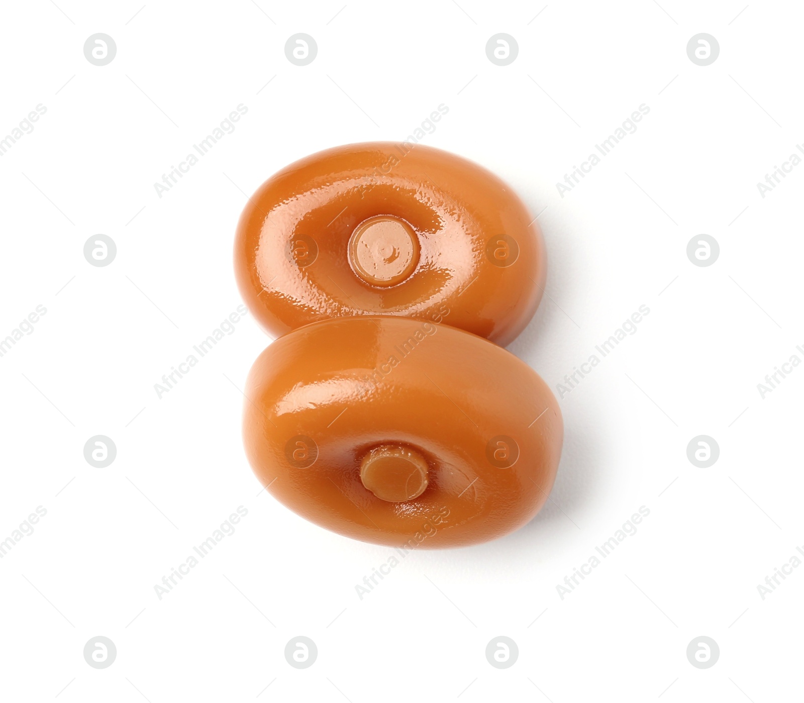 Tasty hard toffee candies isolated on white, top view Photo of Tasty hard toffee candies isolated on white, top view