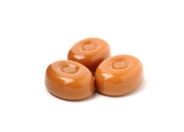 Photo of Tasty hard toffee candies isolated on white