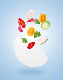 Image of Rice paper and different ingredients falling on light blue gradient background