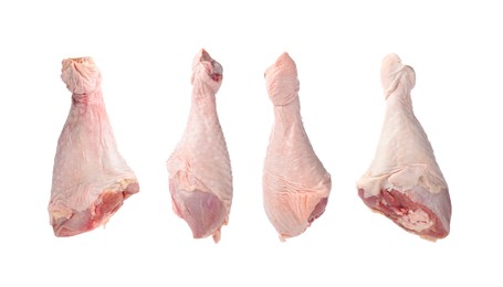 Image of Raw turkey drumsticks isolated on white, set