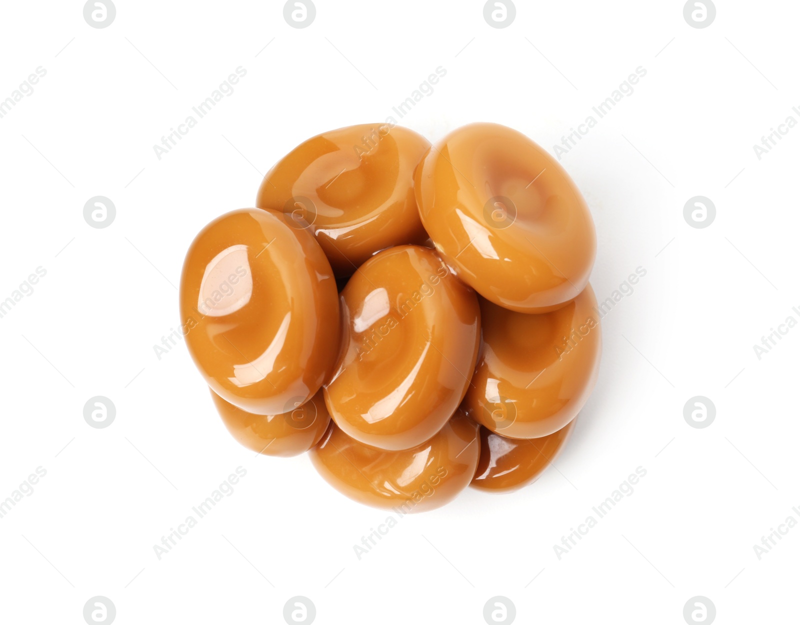 Tasty sweet caramel candies isolated on white, top view Photo of Tasty sweet caramel candies isolated on white, top view