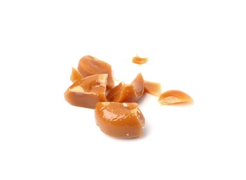 Photo of Tasty sweet caramel candies isolated on white