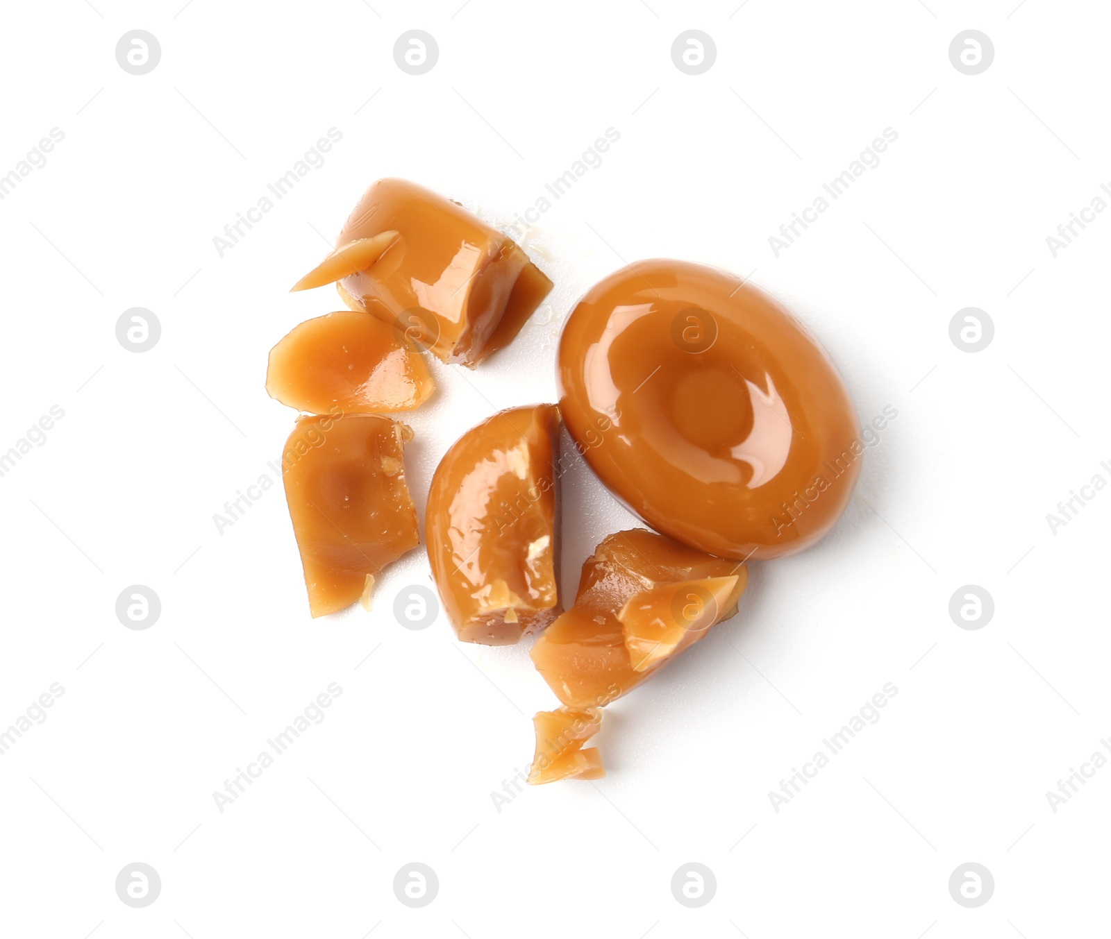 Tasty sweet caramel candies isolated on white, top view Photo of Tasty sweet caramel candies isolated on white, top view