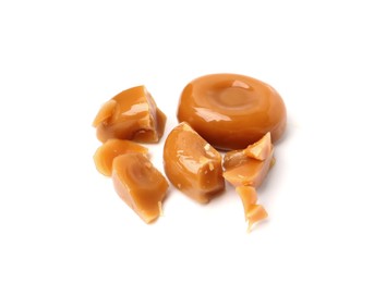 Photo of Tasty sweet caramel candies isolated on white