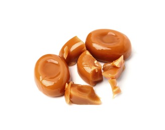 Photo of Tasty sweet caramel candies isolated on white