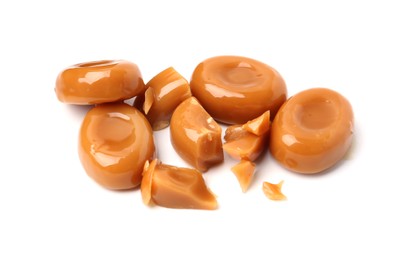Photo of Tasty sweet caramel candies isolated on white