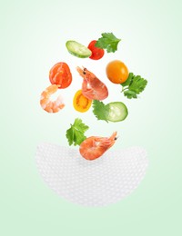 Image of Rice paper and different ingredients falling on aquamarine color gradient background