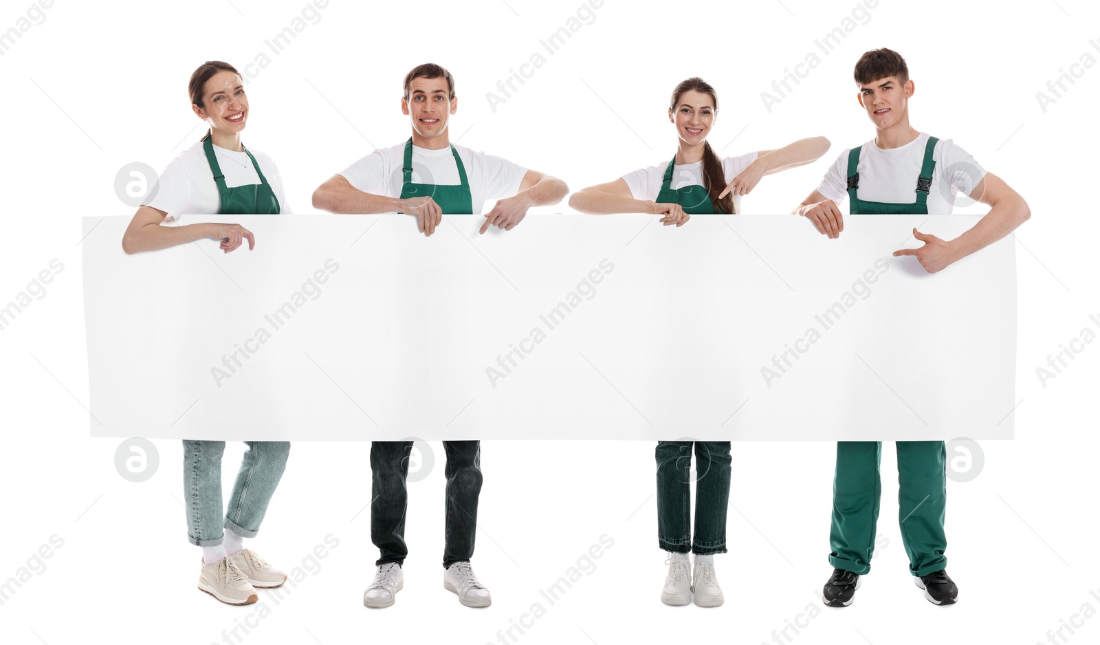 Team of cleaning service workers holding blank banner on white background. Space for text Image of Team of cleaning service workers holding blank banner on white background. Space for text