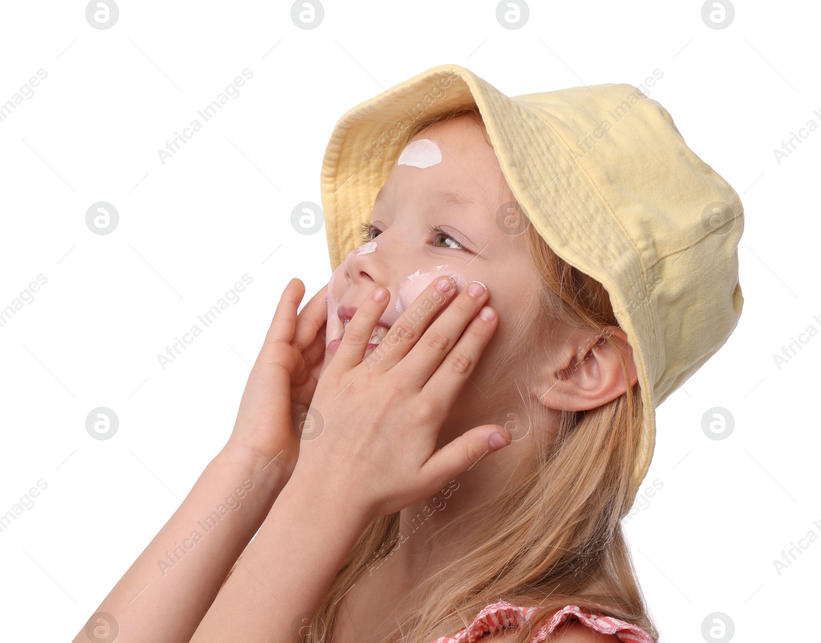 Cute little girl applying sun protection cream onto her skin against white background Photo of Cute little girl applying sun protection cream onto her skin against white background