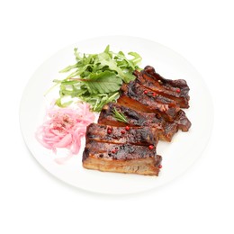 Photo of Delicious spare ribs, onion and arugula isolated on white
