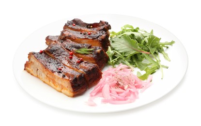 Photo of Delicious spare ribs, onion and arugula isolated on white