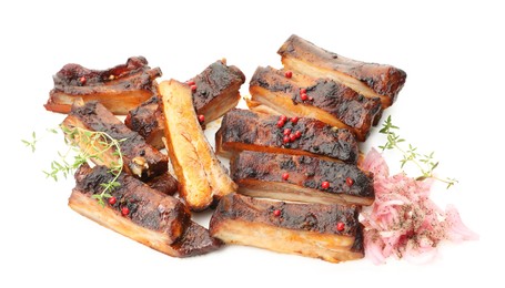 Photo of Delicious pork ribs, thyme and onion isolated on white