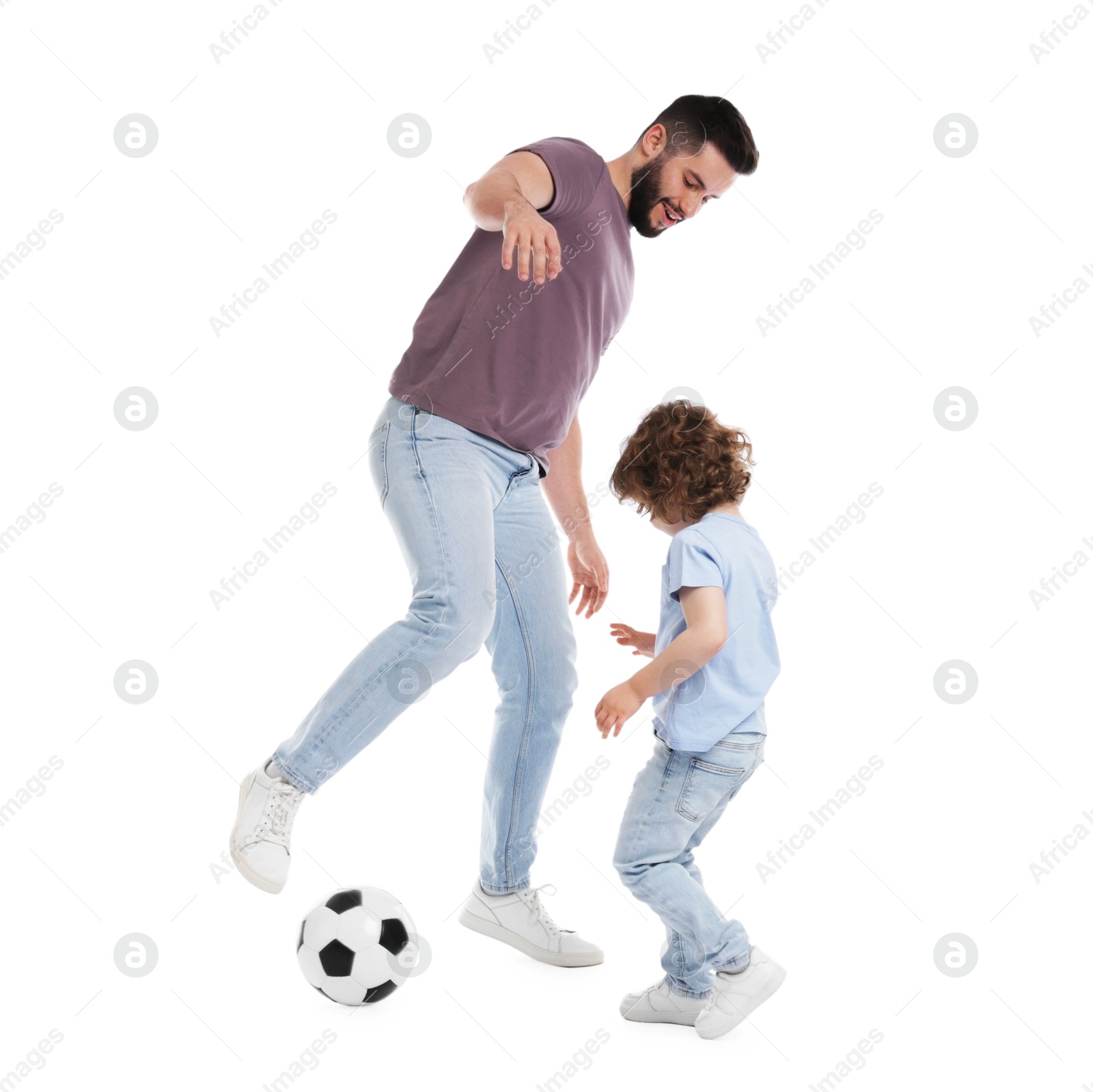 Happy father and his son playing football on white background Photo of Happy father and his son playing football on white background