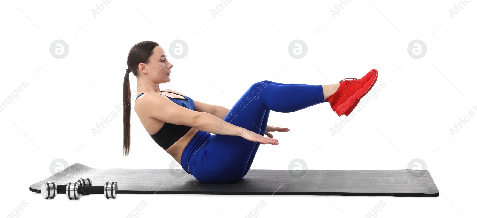 Woman in sportswear exercising on white background Photo of Woman in sportswear exercising on white background