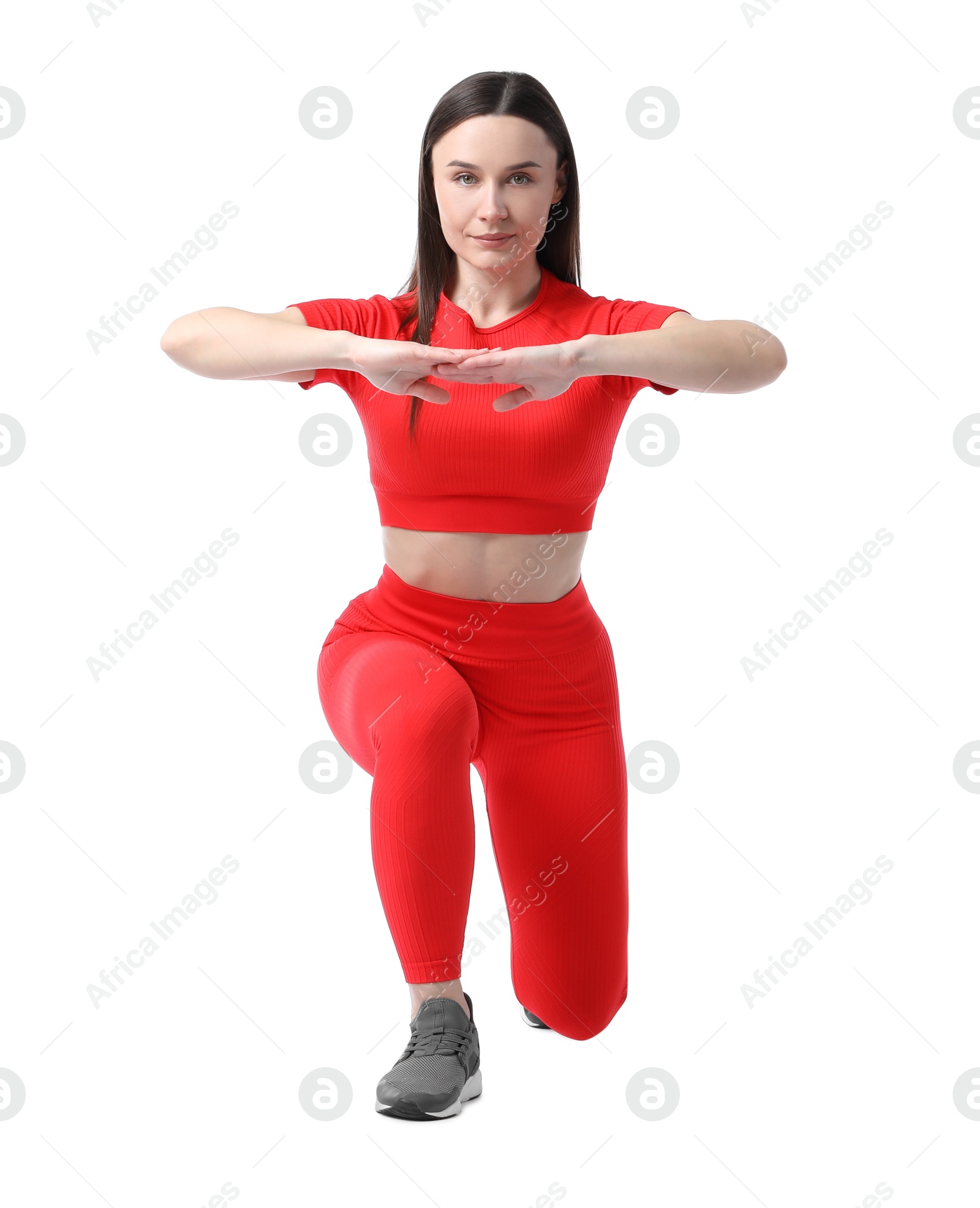 Woman in sportswear exercising on white background Photo of Woman in sportswear exercising on white background