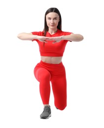 Photo of Woman in sportswear exercising on white background
