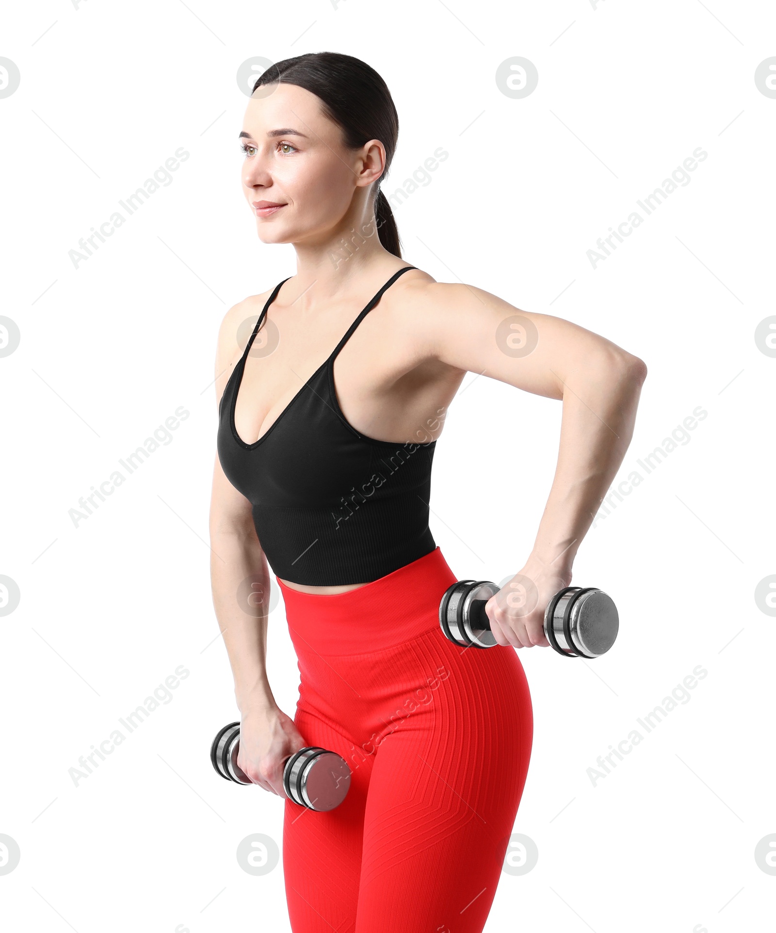 Woman in sportswear exercising with dumbbells on white background Photo of Woman in sportswear exercising with dumbbells on white background