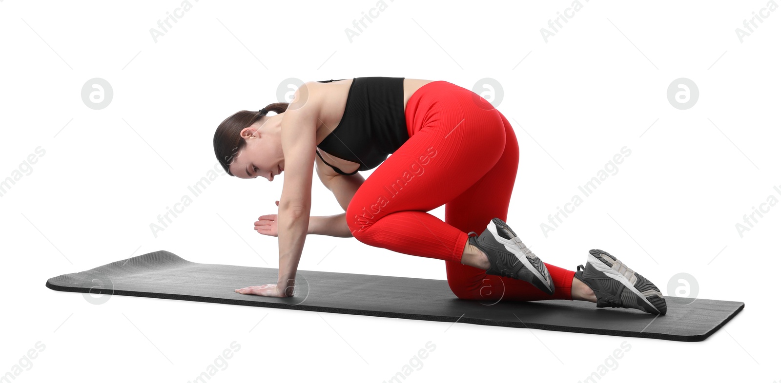 Woman in sportswear exercising on white background Photo of Woman in sportswear exercising on white background
