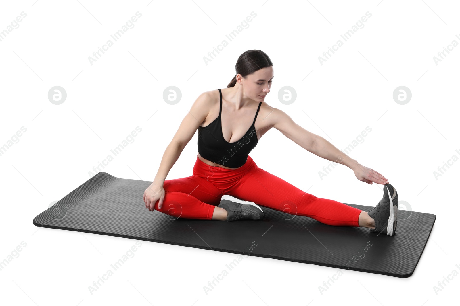 Woman in sportswear exercising on white background Photo of Woman in sportswear exercising on white background