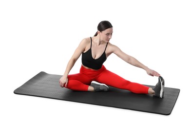 Photo of Woman in sportswear exercising on white background