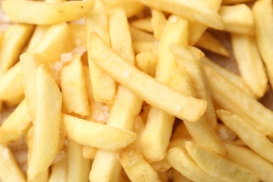 Photo of Tasty french fries as background, top view