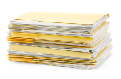 Photo of Stack of file folders with papers isolated on white