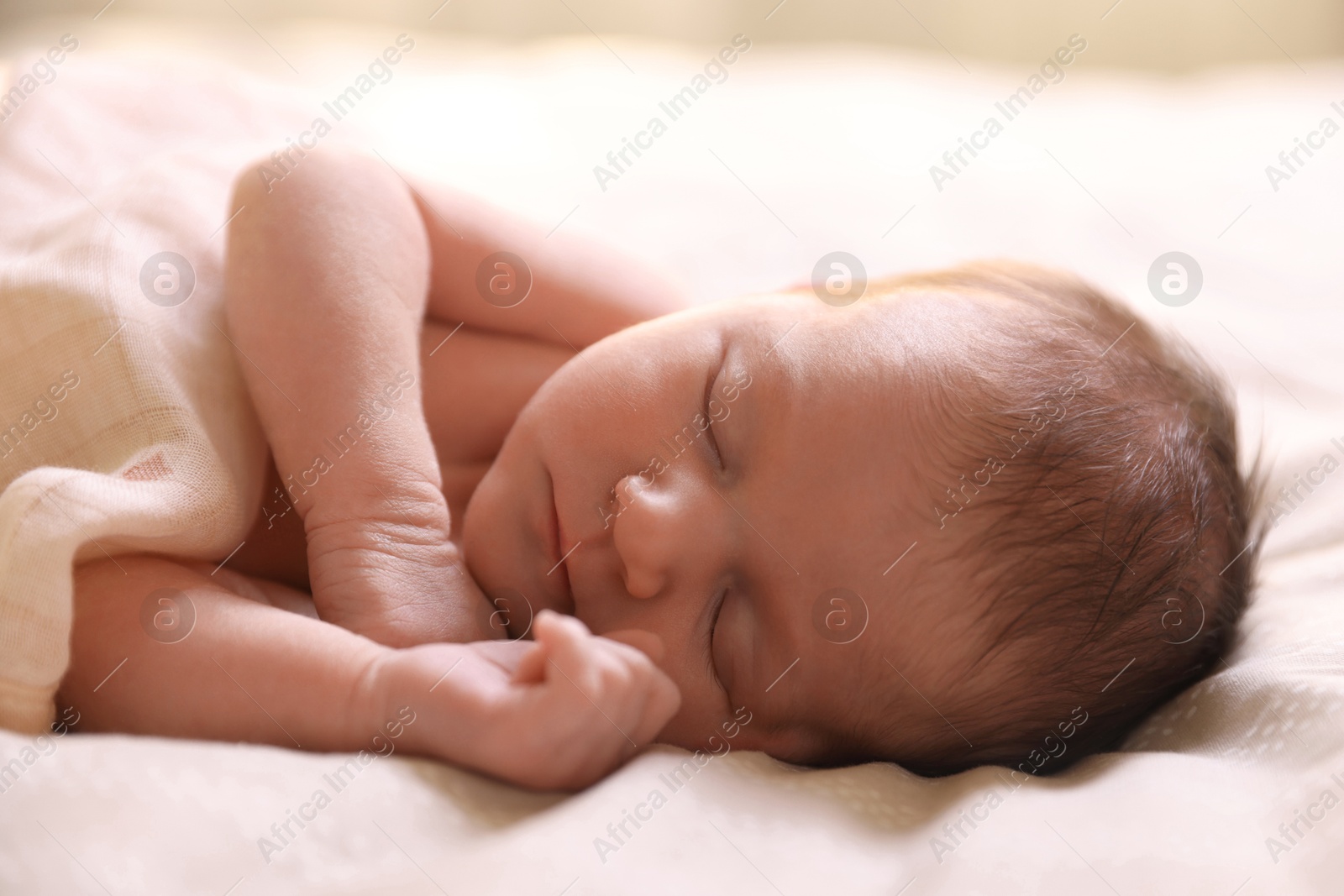 Bedtime. Cute little baby sleeping in bed indoors Photo of Bedtime. Cute little baby sleeping in bed indoors