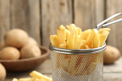 Photo of Tasty french fries served on table, closeup