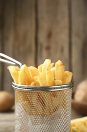 Photo of Tasty french fries served on table, closeup