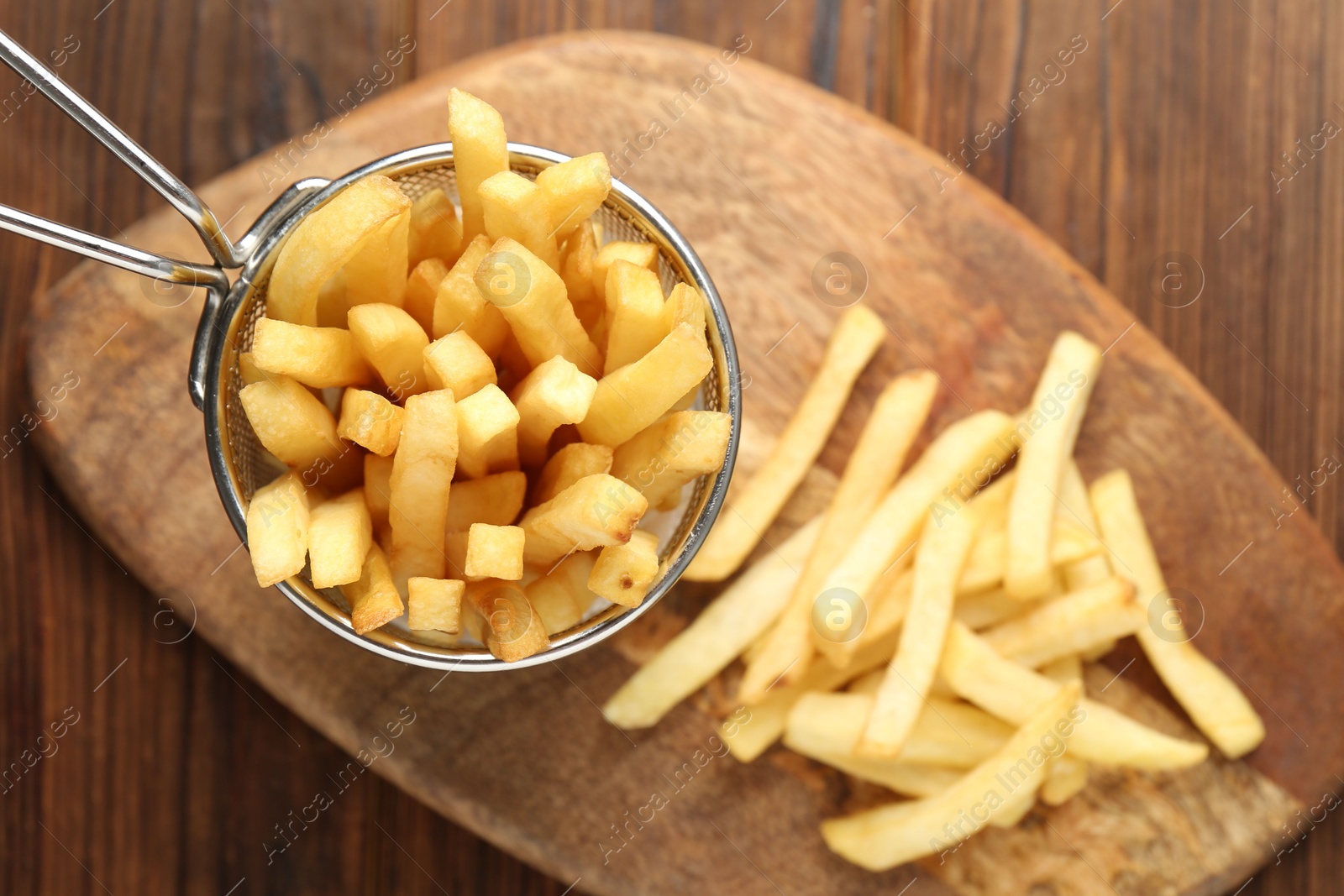 Tasty french fried served on wooden table, top view Photo of Tasty french fried served on wooden table, top view