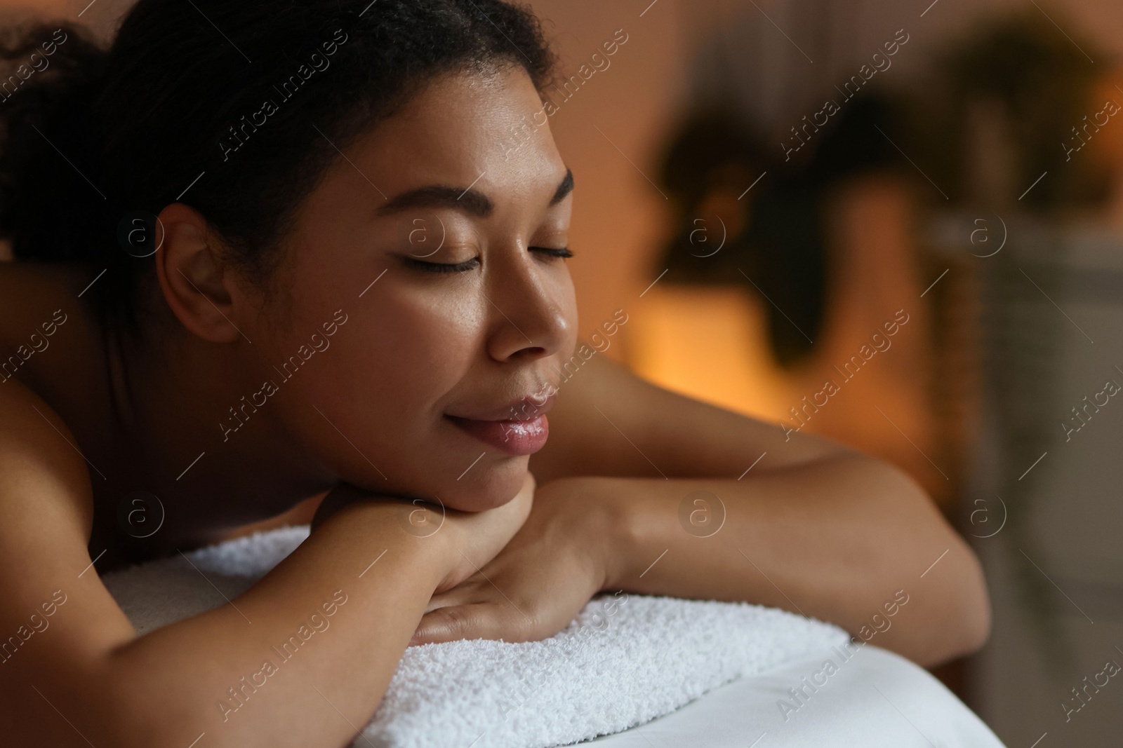 Woman relaxing on massage couch in spa salon, closeup Photo of Woman relaxing on massage couch in spa salon, closeup