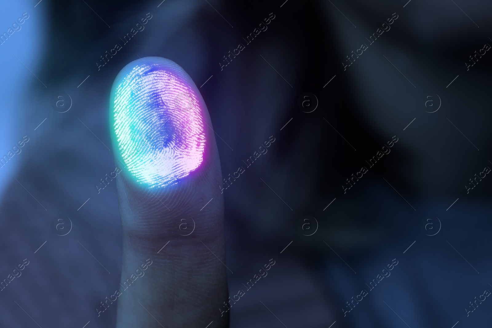 Colorful fingerprint remaining on surface while woman pressing her finger to scanner, closeup Image of Colorful fingerprint remaining on surface while woman pressing her finger to scanner, closeup