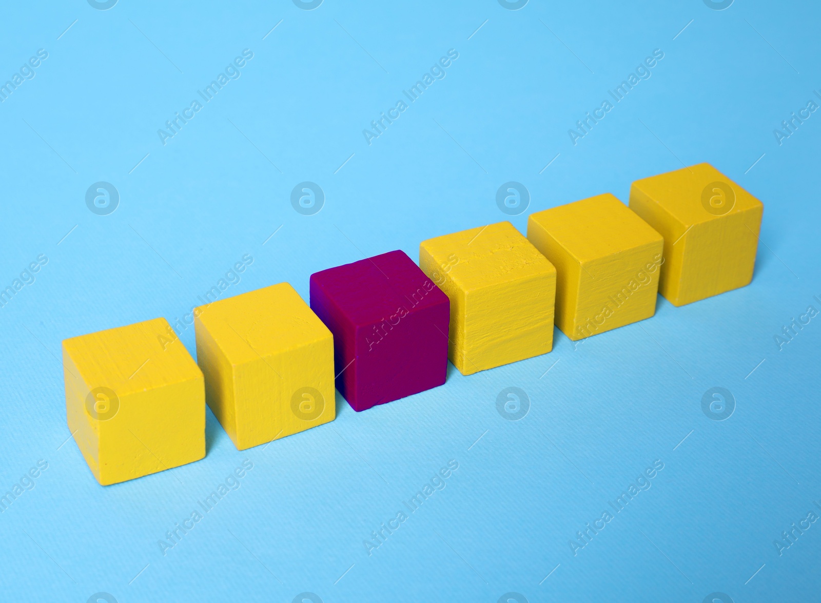 Different, unique, special. Purple cube among yellow ones on light blue background Image of Different, unique, special. Purple cube among yellow ones on light blue background