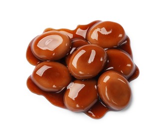 Photo of Tasty sweet candies and caramel sauce isolated on white, top view