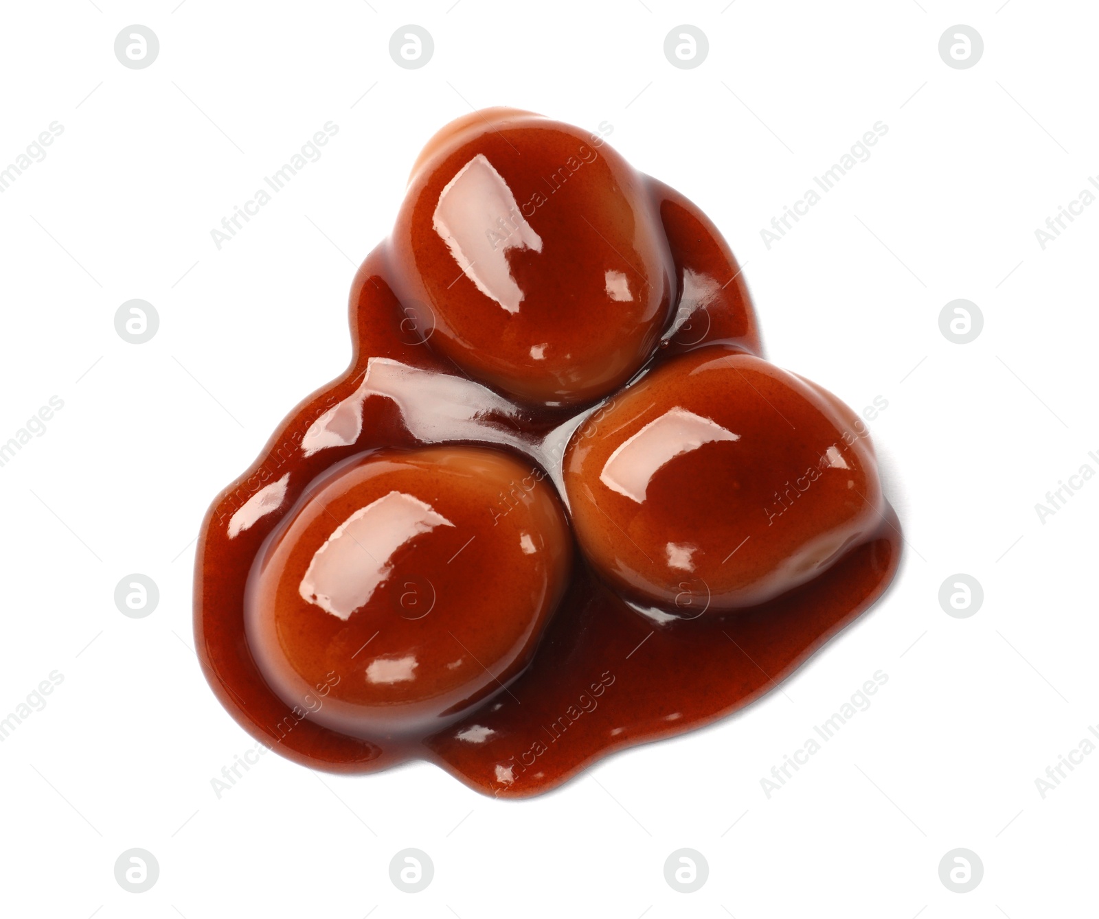 Tasty sweet candies and caramel sauce isolated on white, top view Photo of Tasty sweet candies and caramel sauce isolated on white, top view