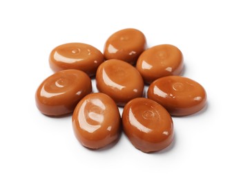 Photo of Tasty sweet caramel candies isolated on white