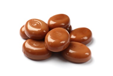 Photo of Tasty sweet caramel candies isolated on white