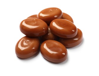 Photo of Tasty sweet caramel candies isolated on white