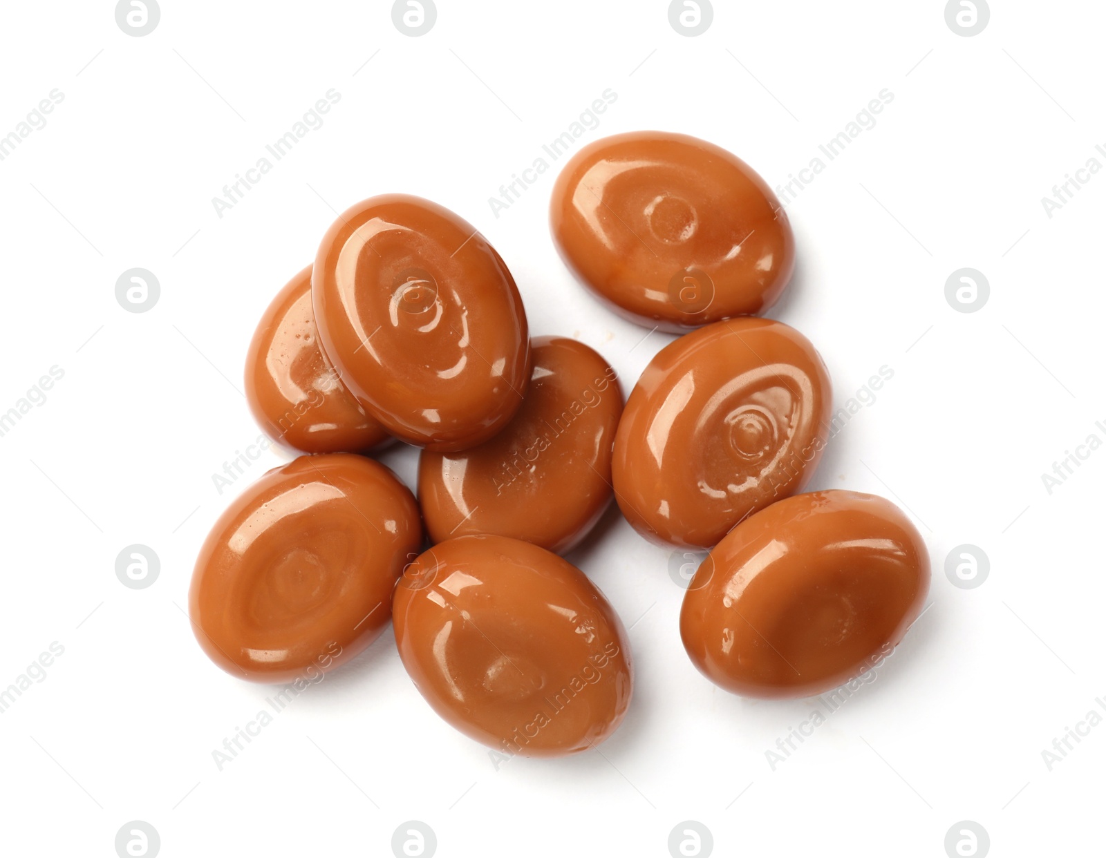 Tasty sweet caramel candies isolated on white, top view Photo of Tasty sweet caramel candies isolated on white, top view