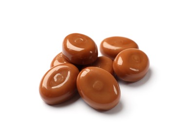 Photo of Tasty sweet caramel candies isolated on white