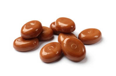 Photo of Tasty sweet caramel candies isolated on white