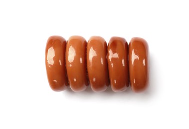 Photo of Tasty sweet caramel candies isolated on white, top view