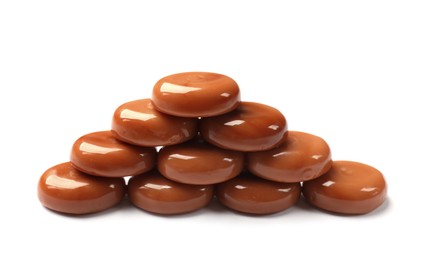 Photo of Tasty sweet caramel candies isolated on white