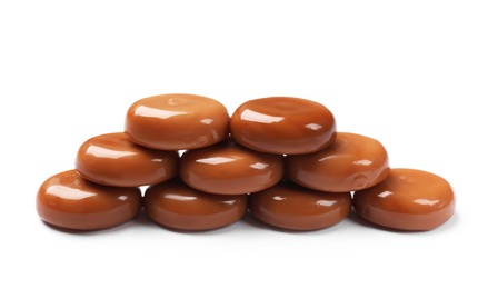 Photo of Tasty sweet caramel candies isolated on white