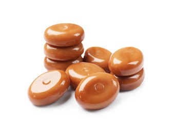 Photo of Tasty sweet caramel candies isolated on white