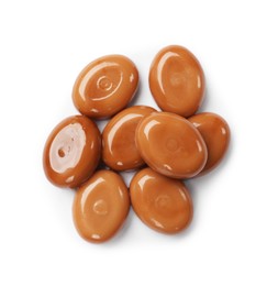 Photo of Tasty sweet caramel candies isolated on white, top view
