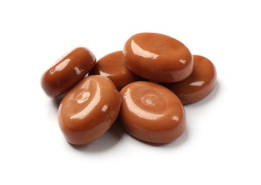 Photo of Tasty sweet caramel candies isolated on white